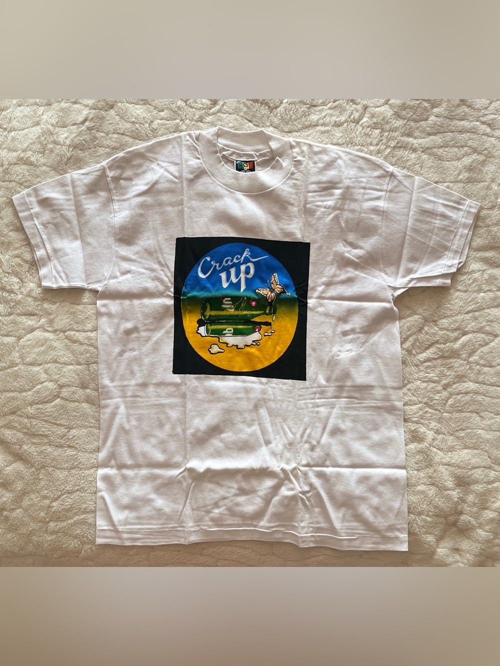 Vintage “Crack Up" promotional t-shirt features a bold graphic of broken bottles